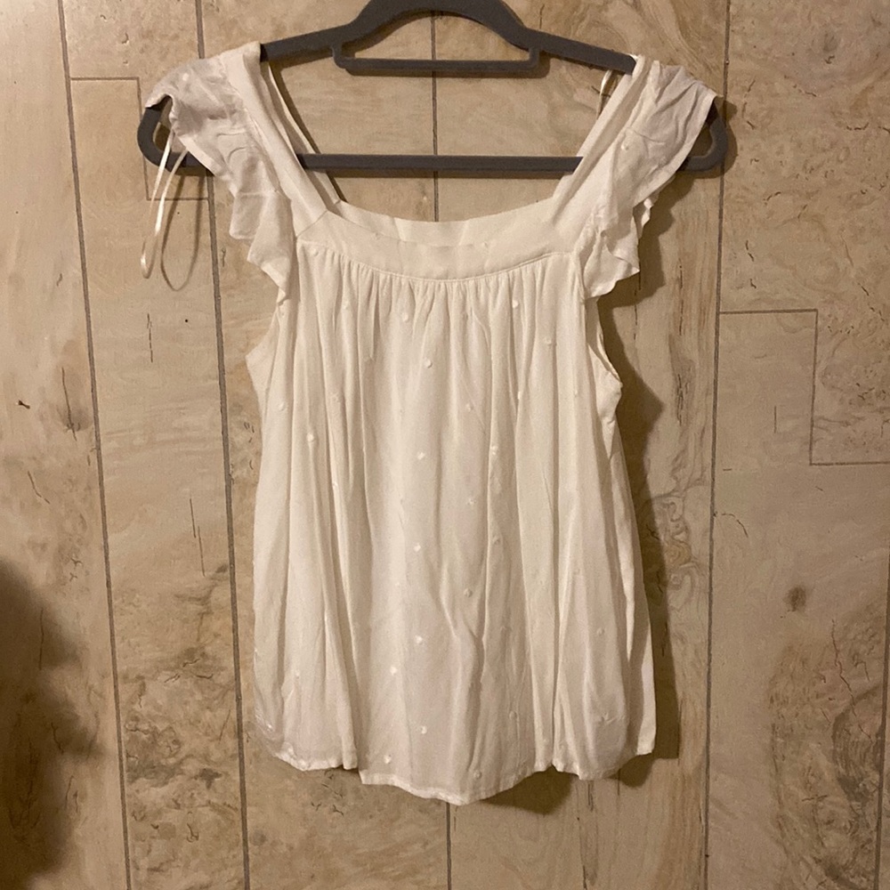 White blouse from Francesca’s. Size small. Ruffle and polkadot detailing.
